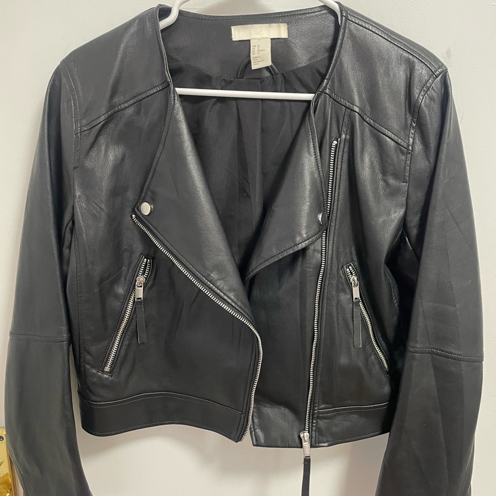Pre-worn faux leather jacket.